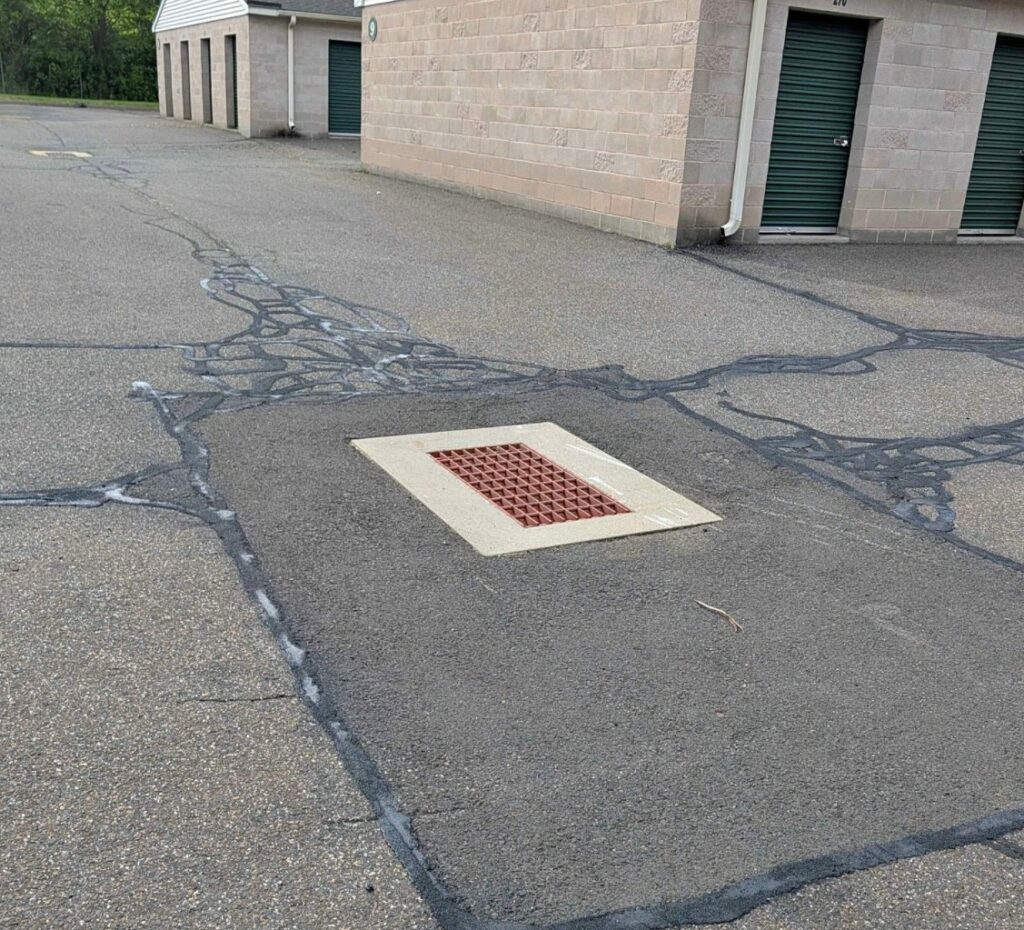 Asphalt Patch and Crack Filling Around Drainage in Reading, Massachusetts